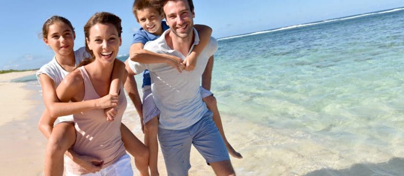 smiling family at the beach