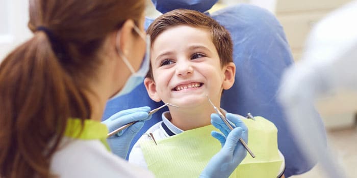 boy with baby teeth